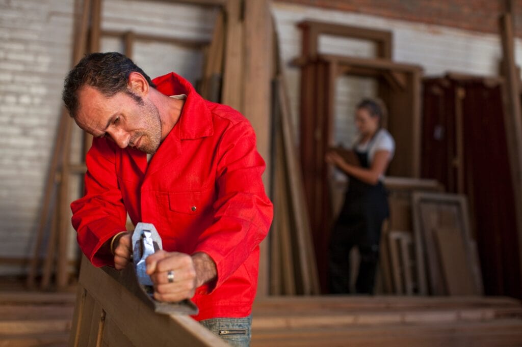 Carpenter using plane