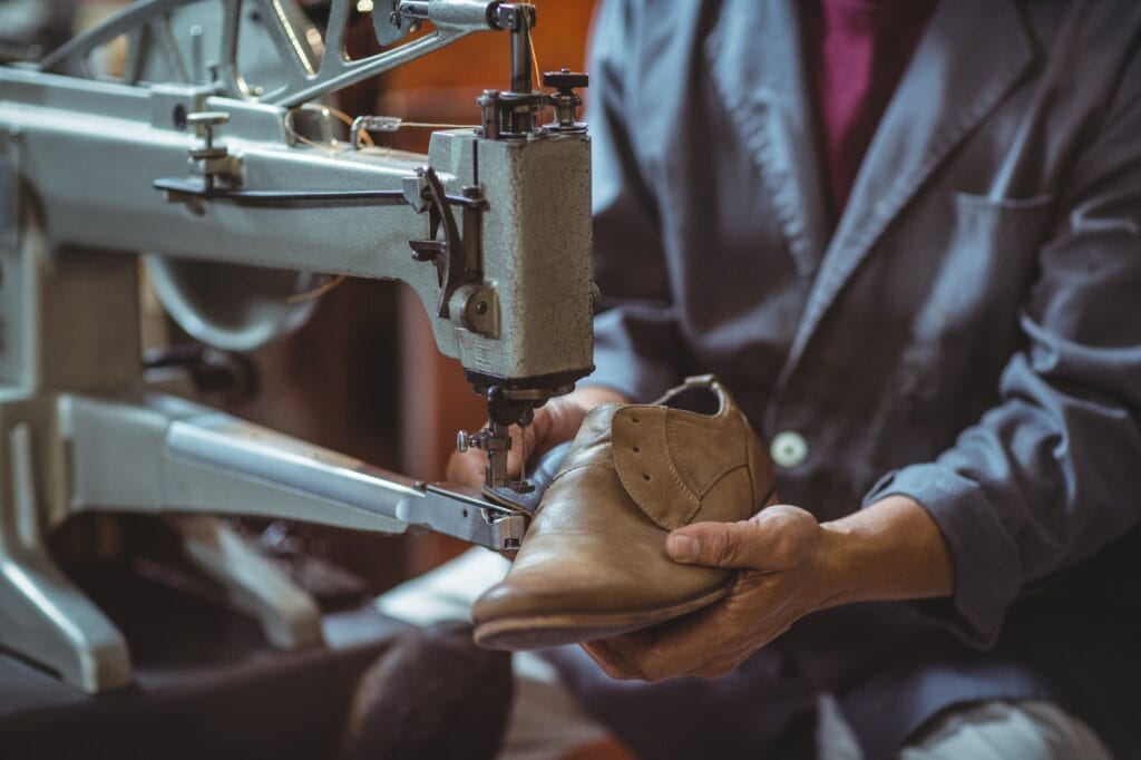 Shoemaker using sewing machine